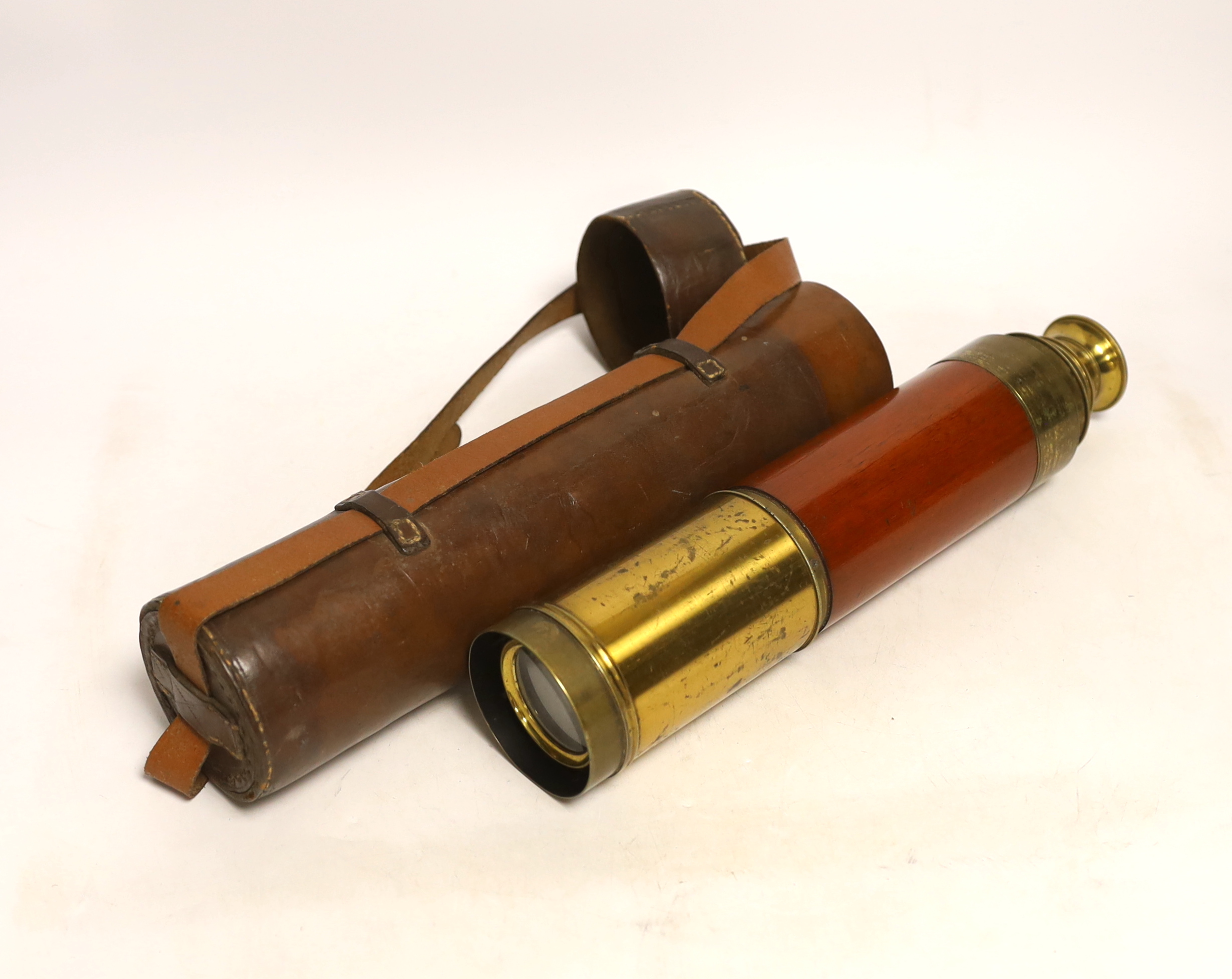 A Victorian walnut tea caddy and 19th century leather cased three draw telescope, signed Silberrad